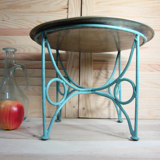 Small metal coffee table or plant stand.