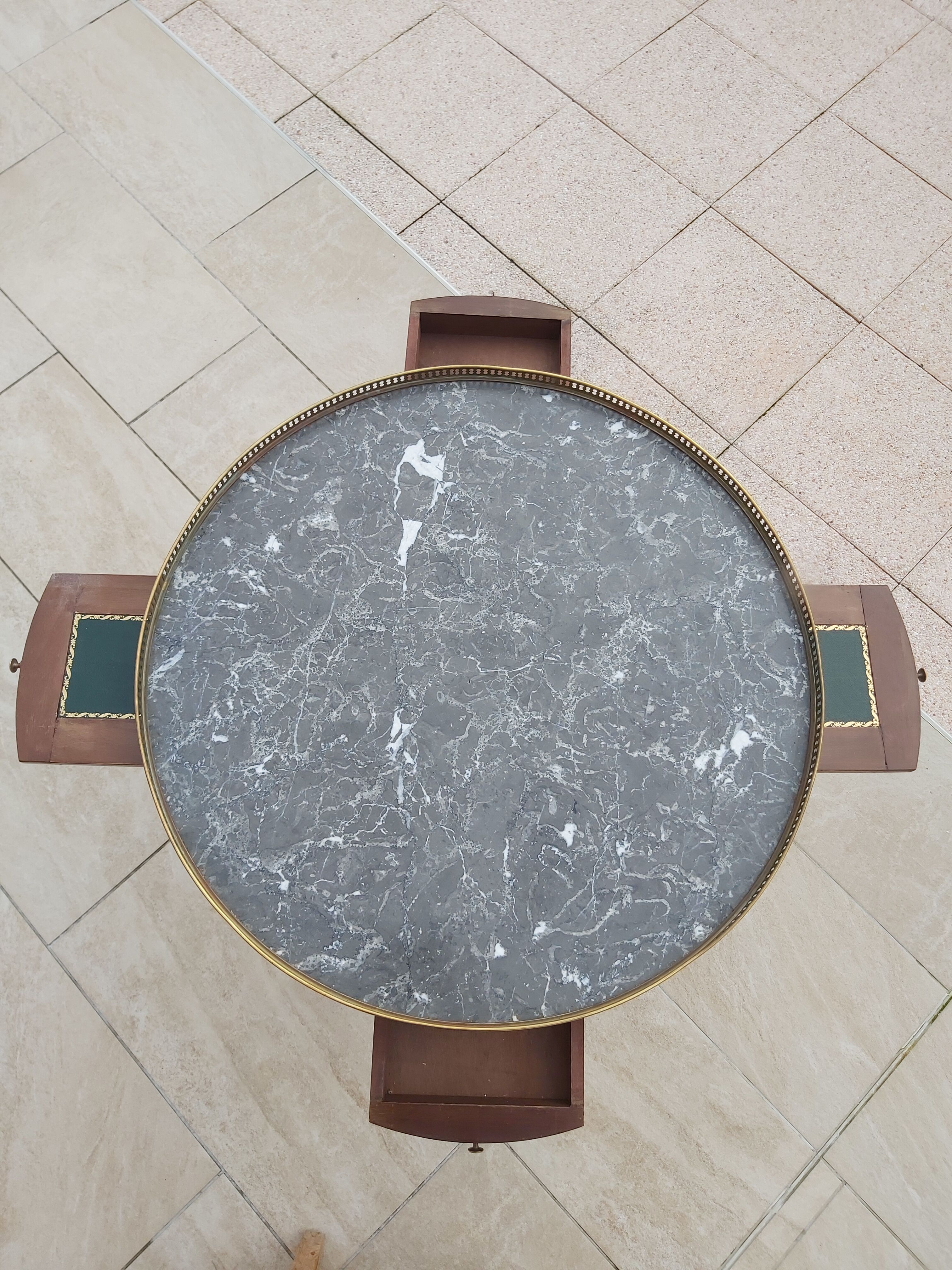 Gray marble mahogany pedestal table and brass gallery