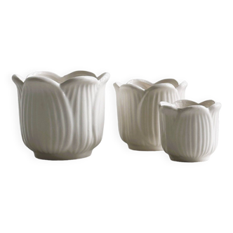 Three white ceramic planters, tulip shape