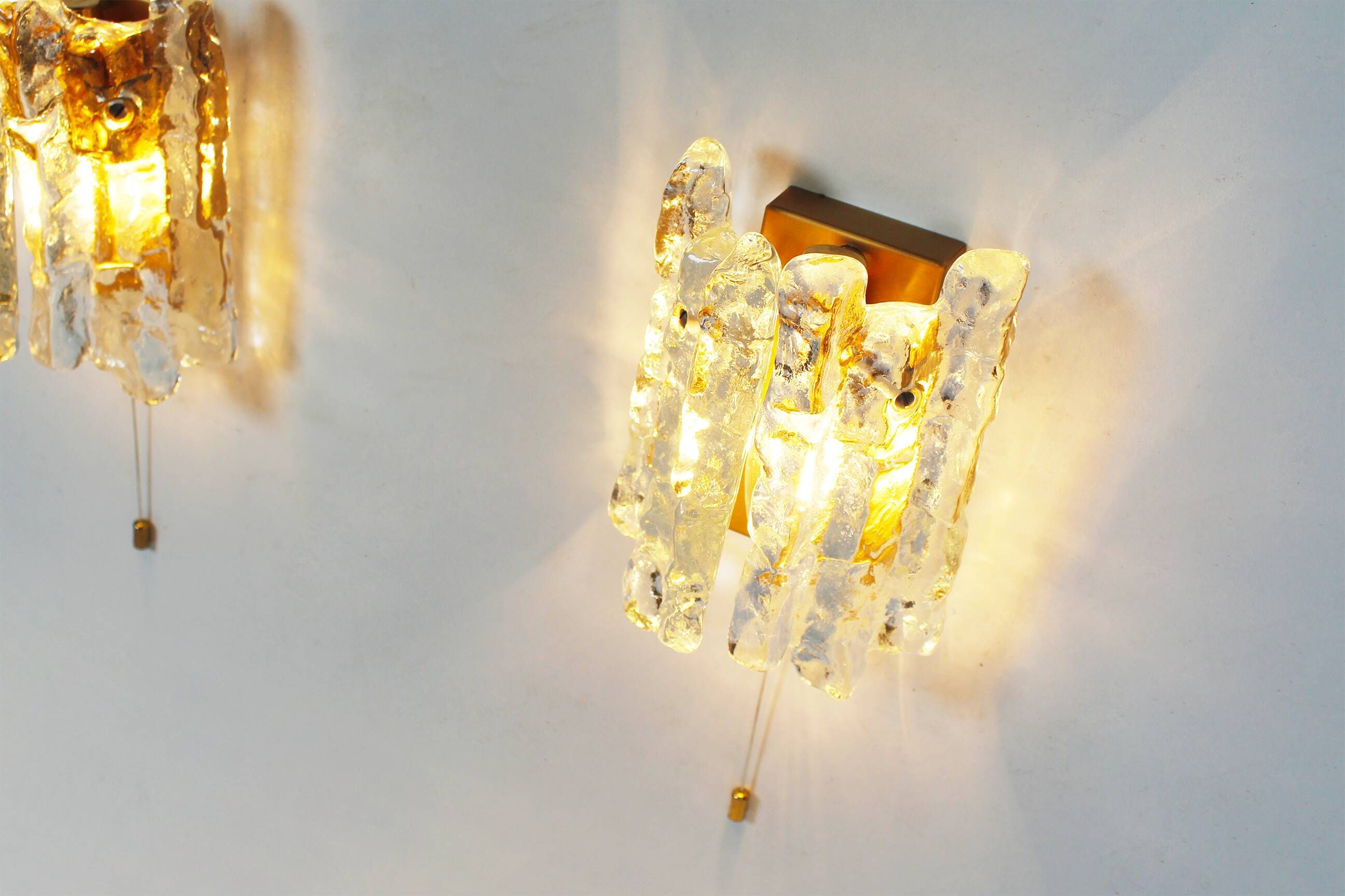 Set of two brass and heavy ice glass sconces by Kalmar, Austria 1970’s