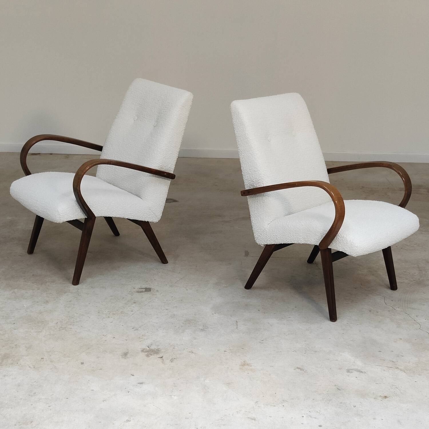 Pair of Jaroslav Smidek armchairs for Ton Bystrice, restored with white boucle, 1960.