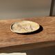 Small beige oval petrified wood dish or tray with crystals.
