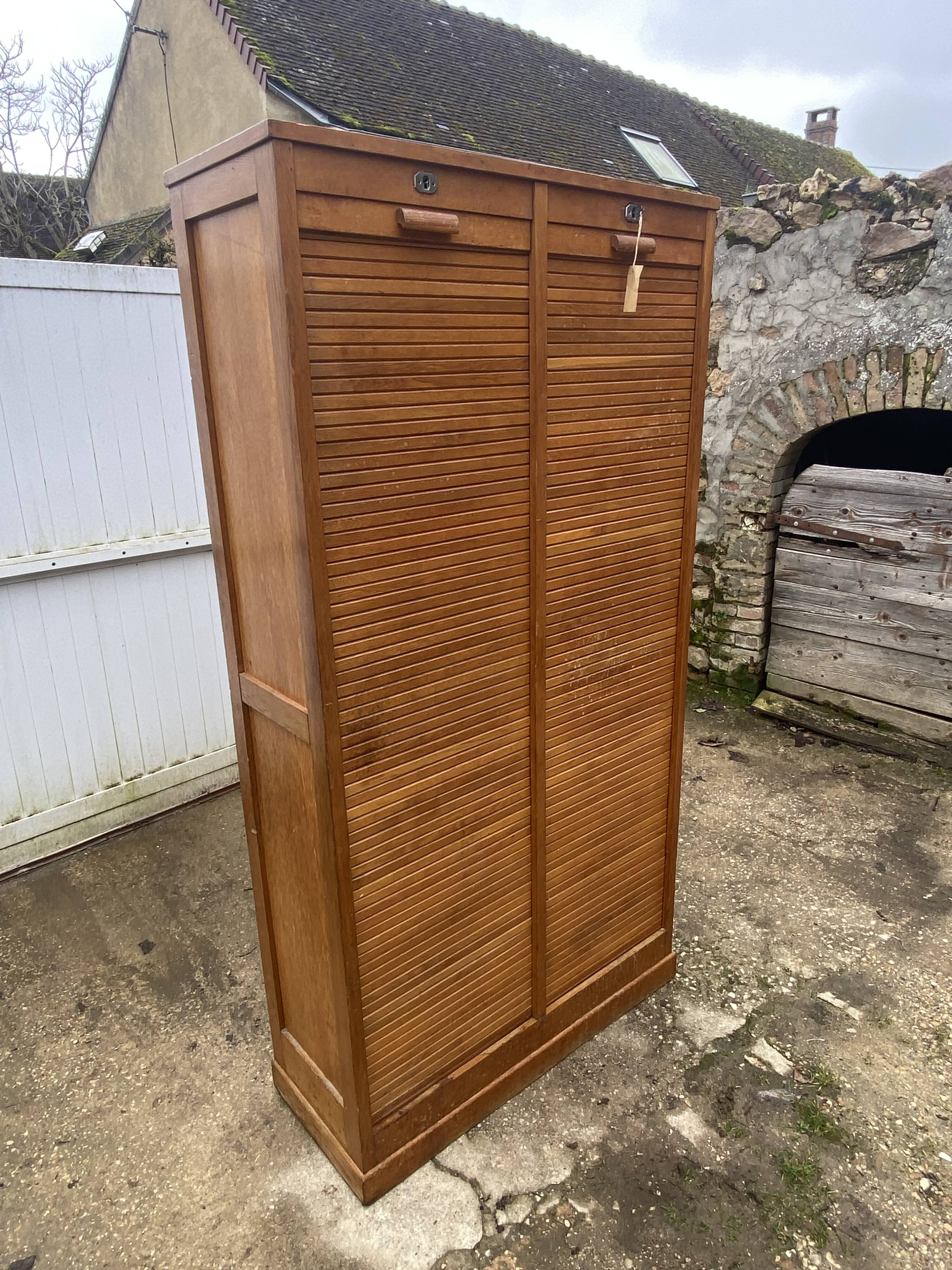 Double-column oak filing cabinet with curtains, 1950s.