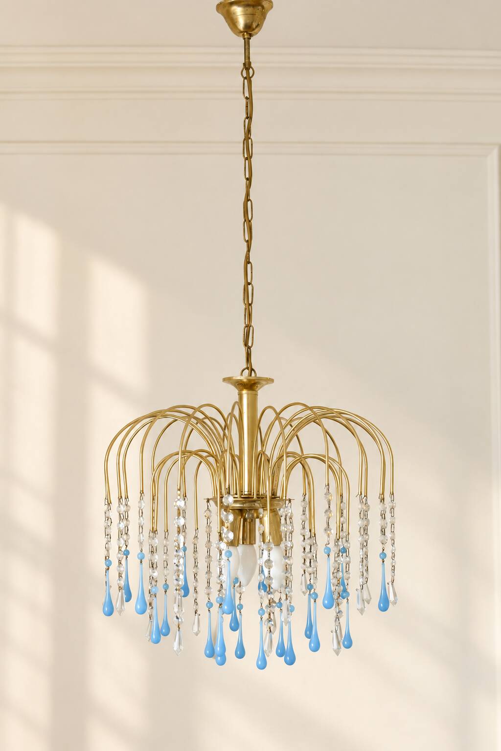 Vintage chandelier with blue Murano glass pendants.