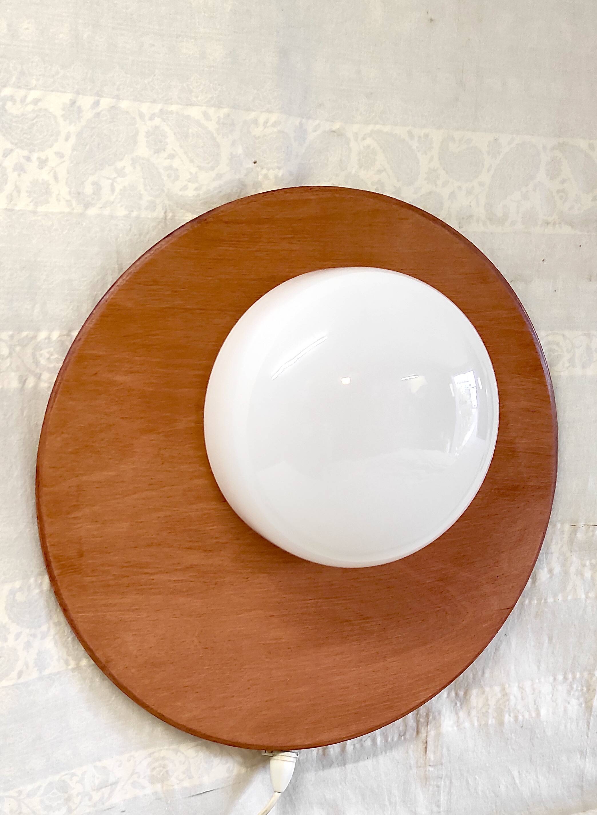 Globe-shaped wall sconces in opaline glass and wood - mid-20th century