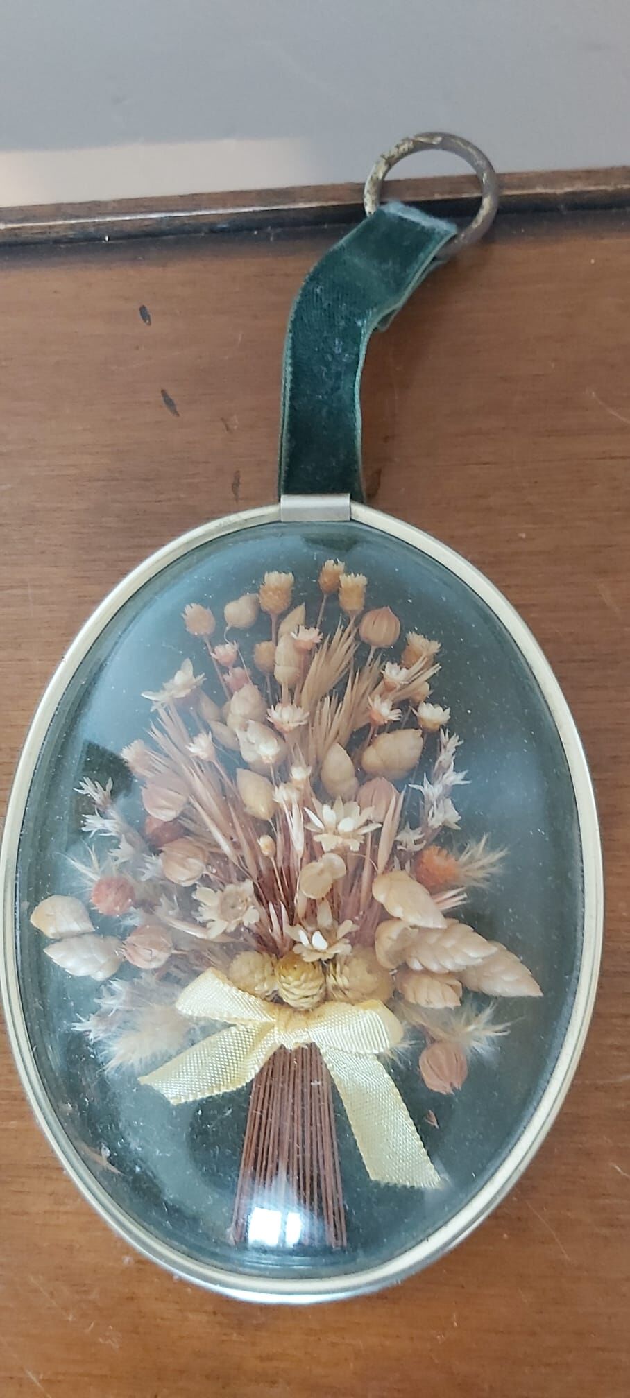 3 frames of dried flowers in curved glass