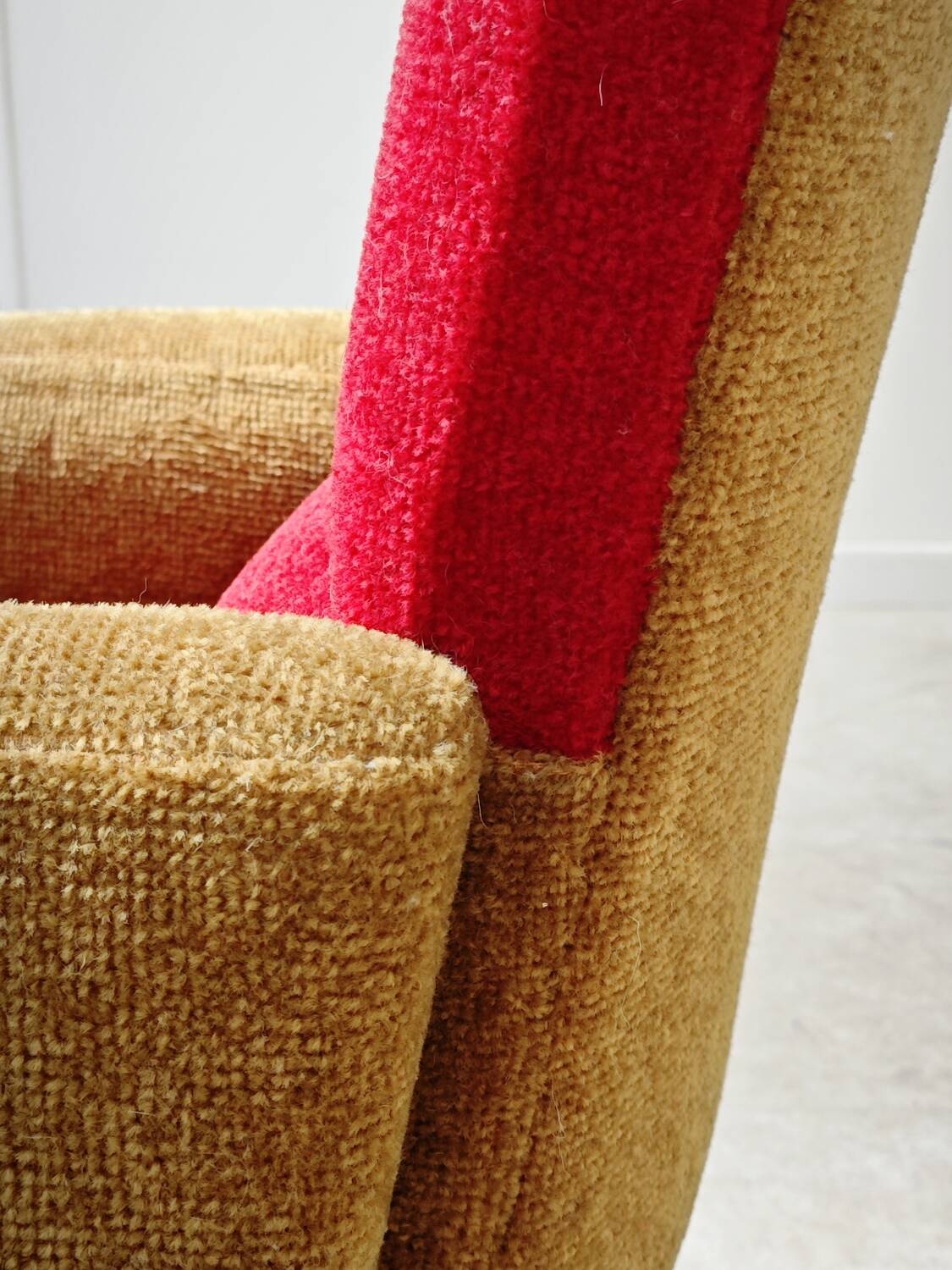 Red and mustard yellow fabric armchair in 1970s style