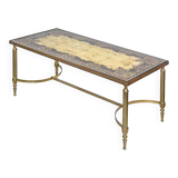 Coffee table in gilded brass