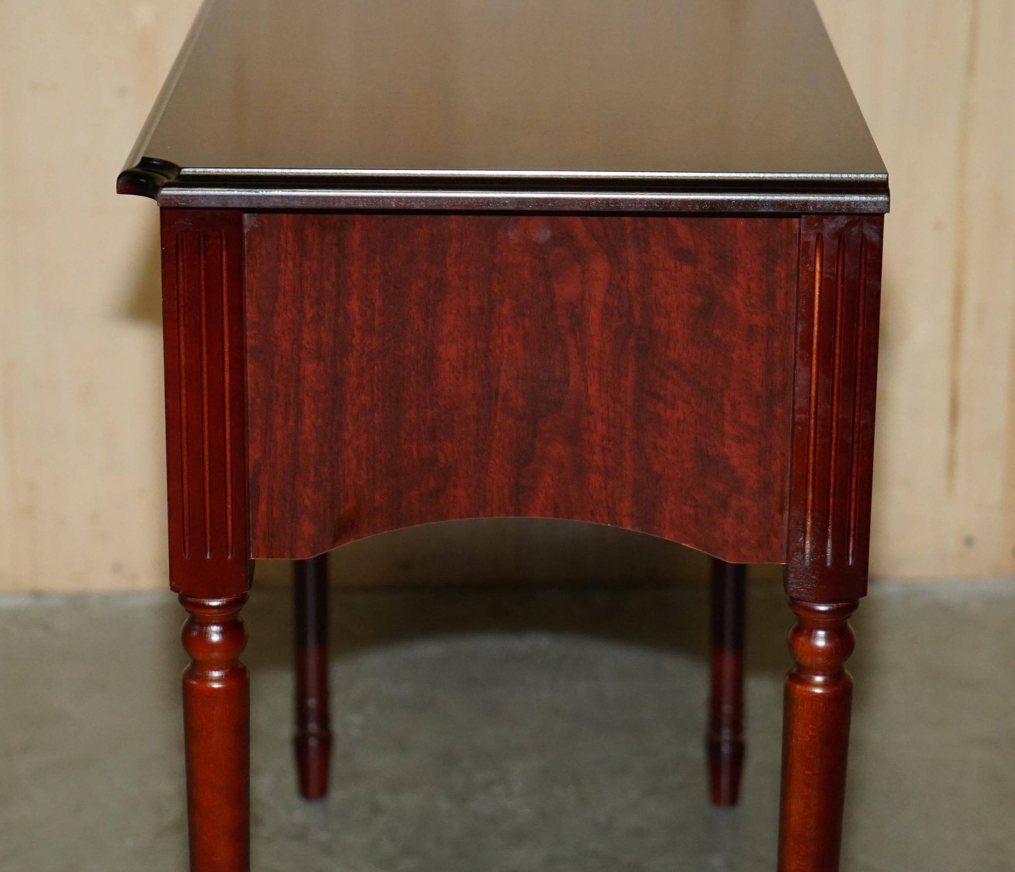 Small console with two drawers in hardwood finish.