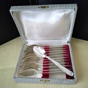 Set of 12 silver-plated coffee spoons in "shell" design.