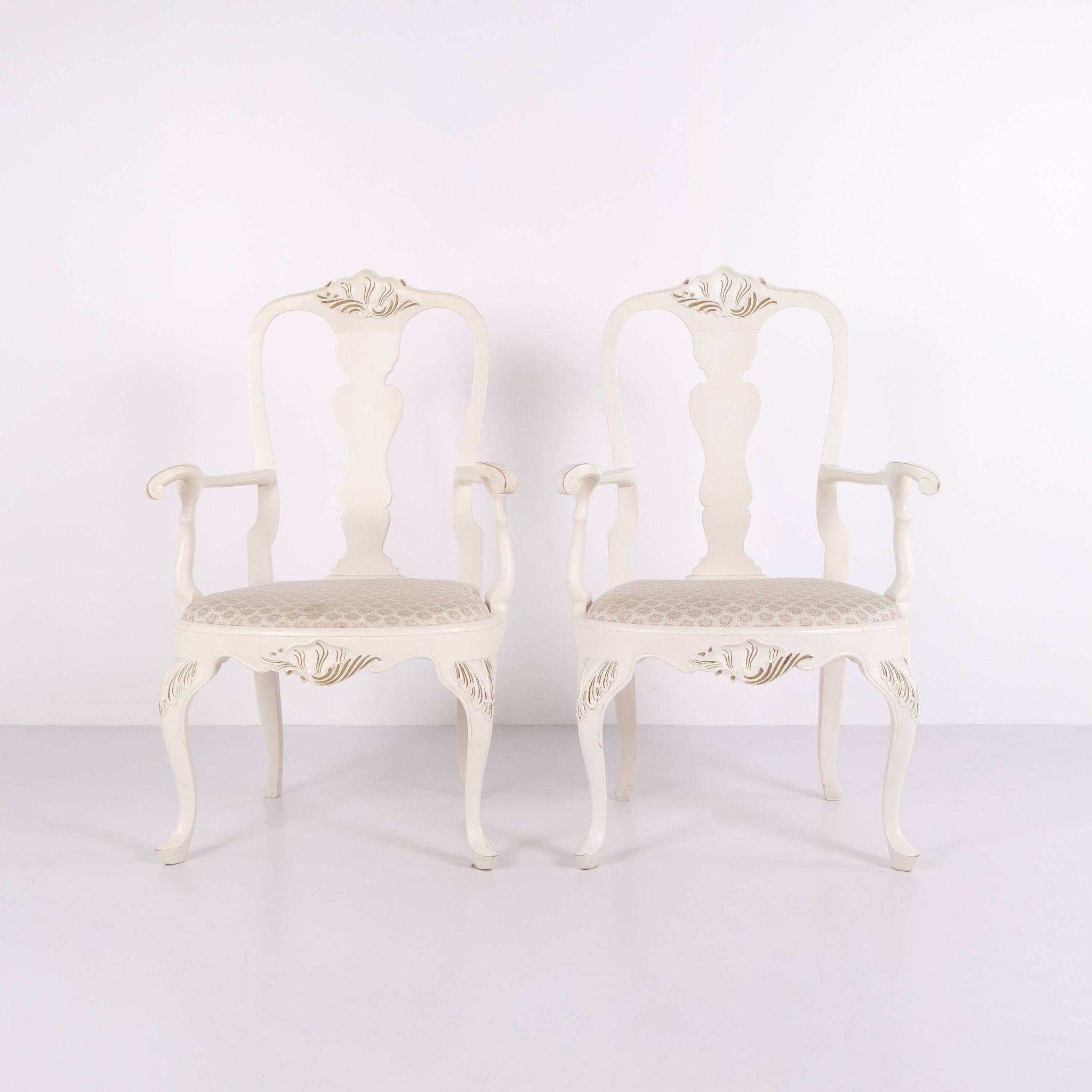 A pair of armchairs – neo rococo style – white painted with decorative details – 1920s