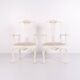 A pair of armchairs – neo rococo style – white painted with decorative details – 1920s