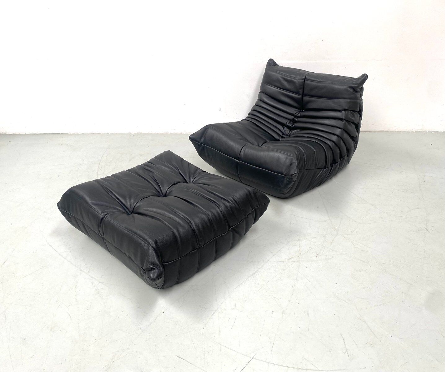 Togo chair and pouffe-black leather attributed to Ducaroy for Ligne Roset.