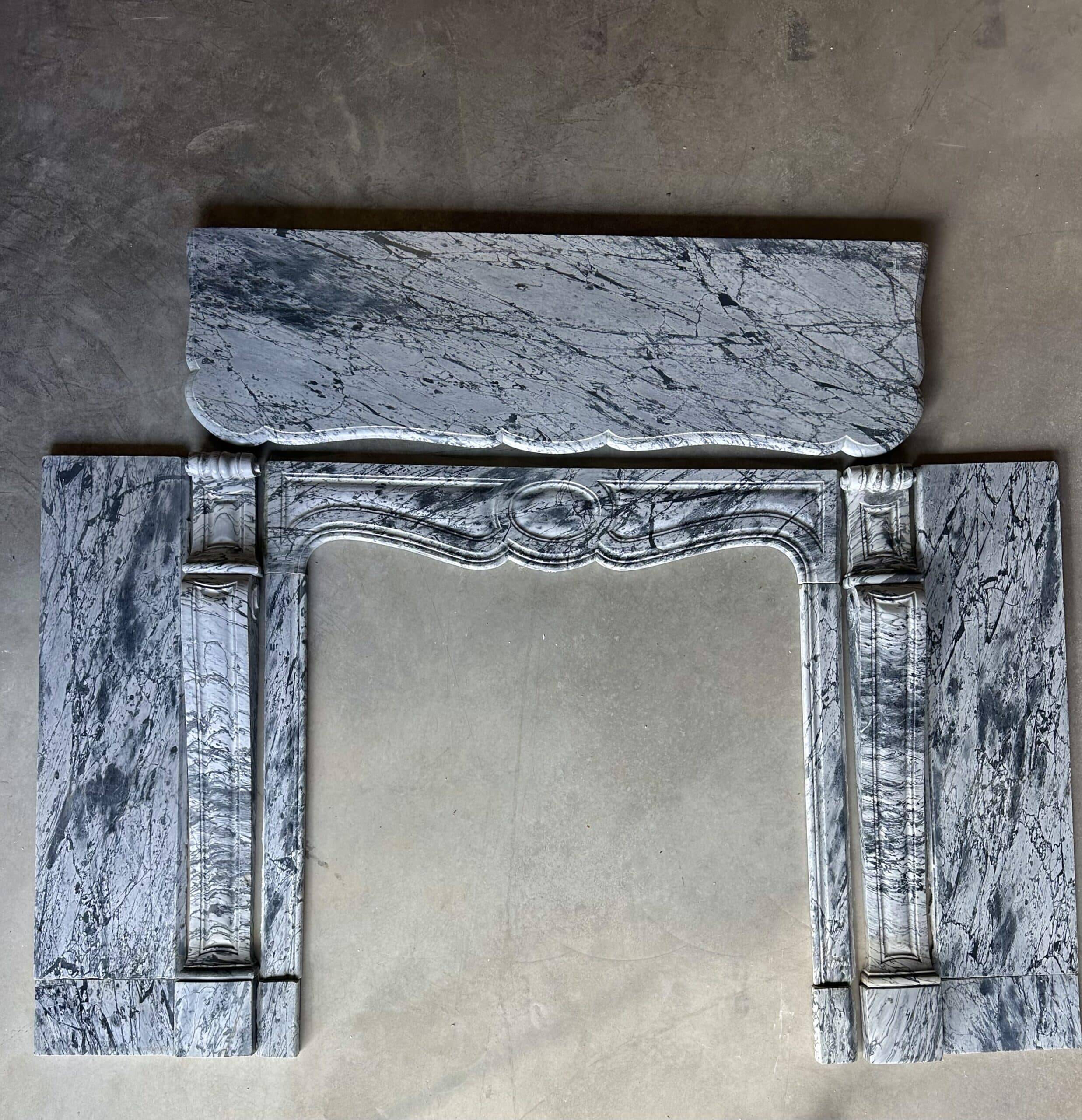 Pompadour fireplace in Louis XV style from around 1880 in blue floral marble.