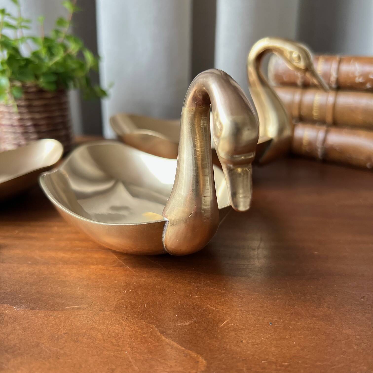 Trio of “swan” cups in gilded brass