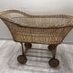 Rattan cradle on wheels