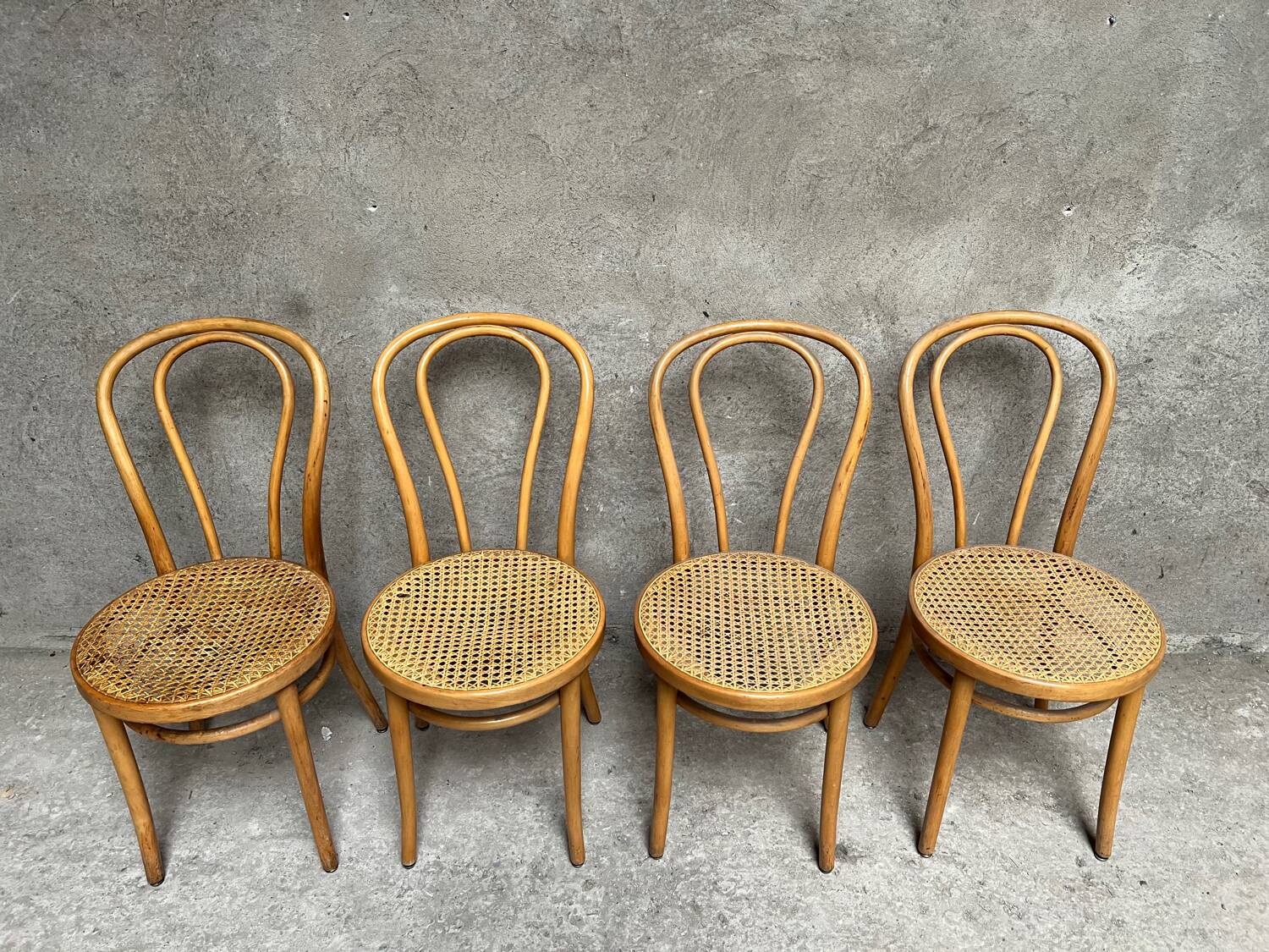 Set of 4 vintage bistro chairs in curved wood and cane seats 1950 1960