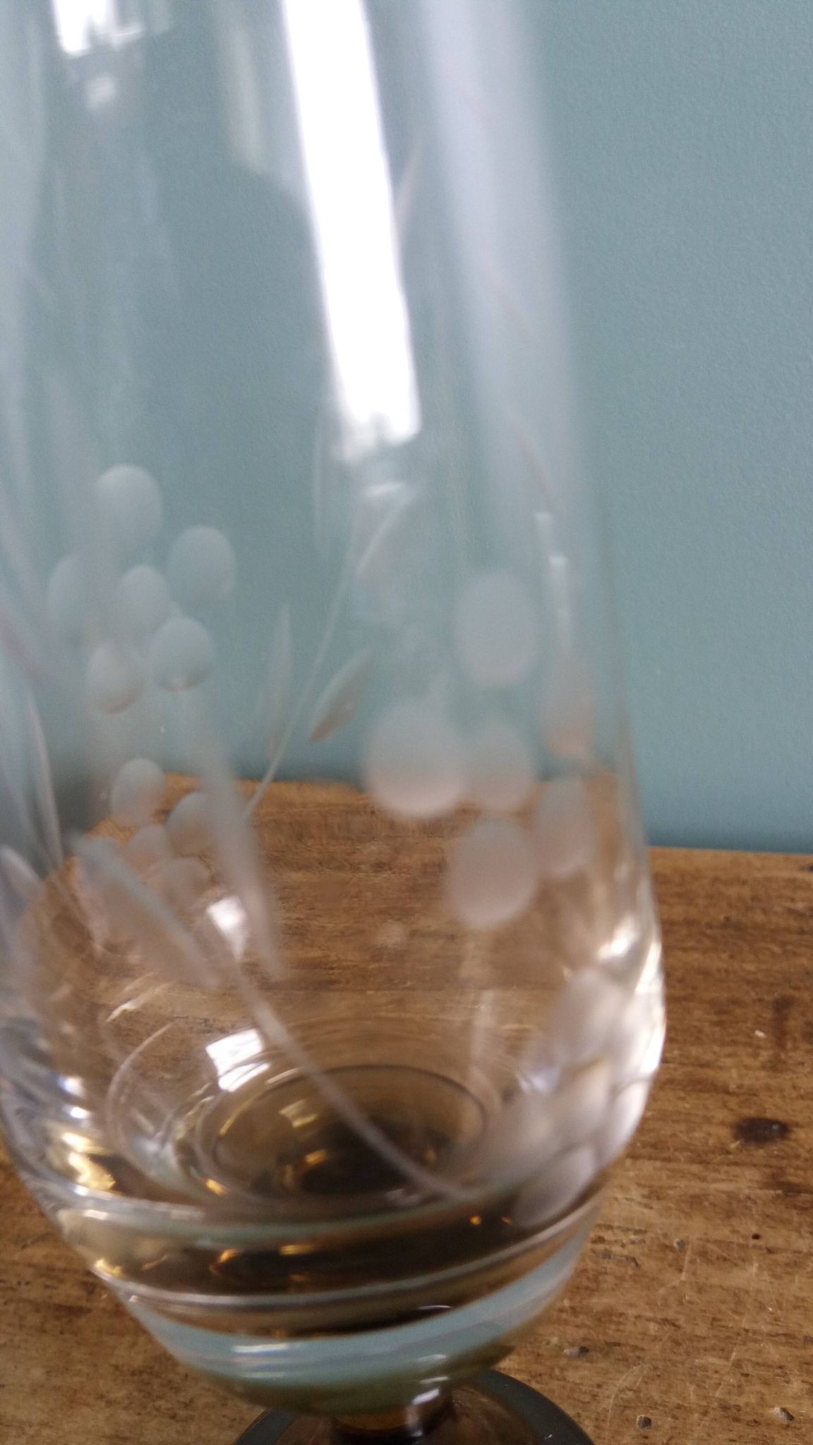 Cut glass soliflore vase with a smoked glass base.