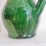 Antique green pitcher in painted terracotta