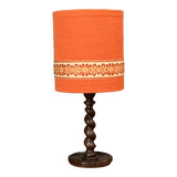 Mid-20th century turned wooden lamp with orange fabric lampshade