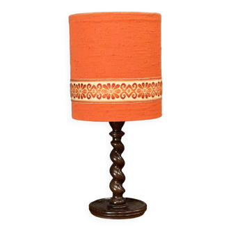 Mid-20th century turned wooden lamp with orange fabric lampshade