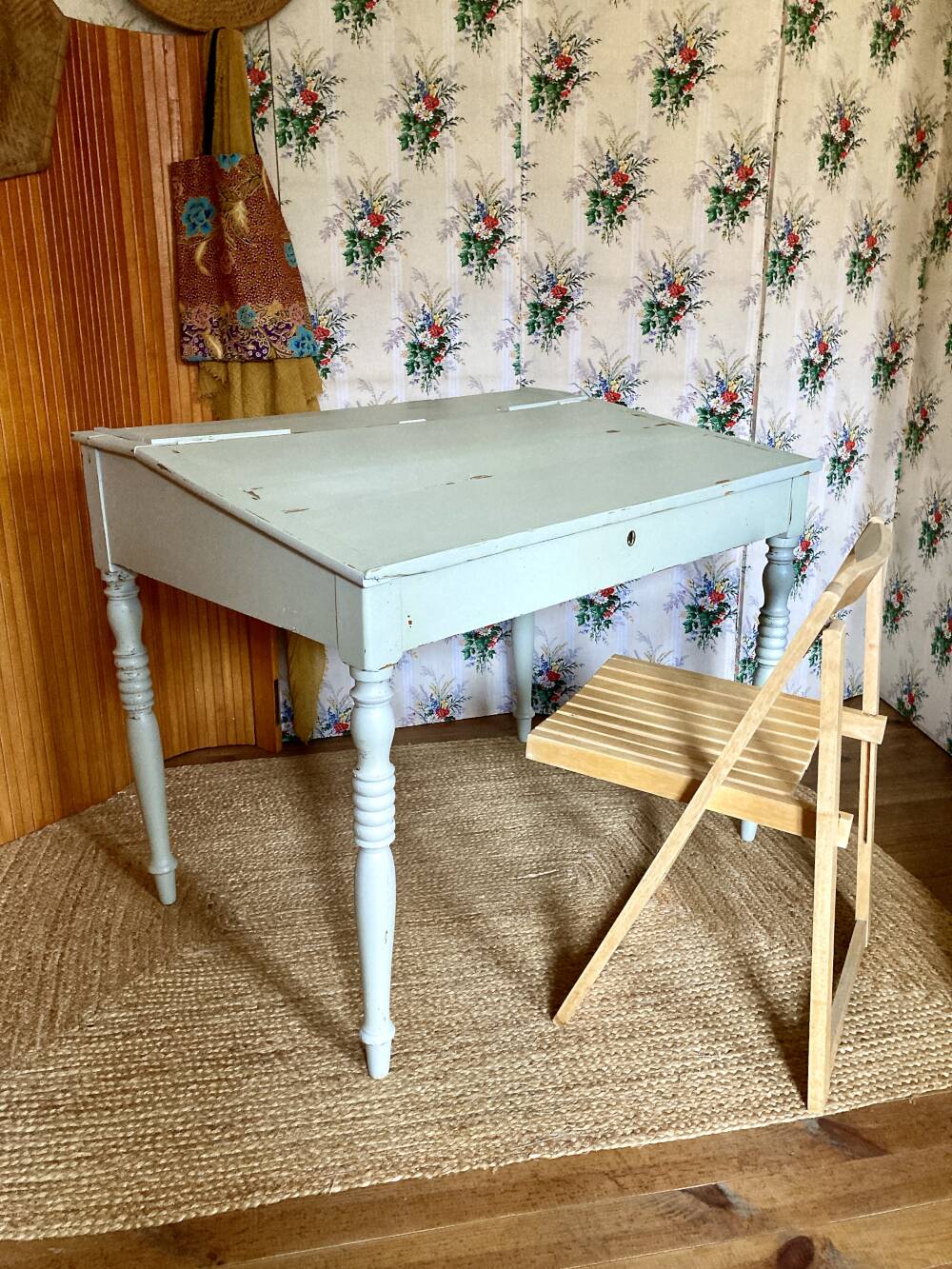 Antique wooden sloped desk, with a drop-down front and turned legs.