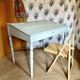 Antique wooden sloped desk, with a drop-down front and turned legs.