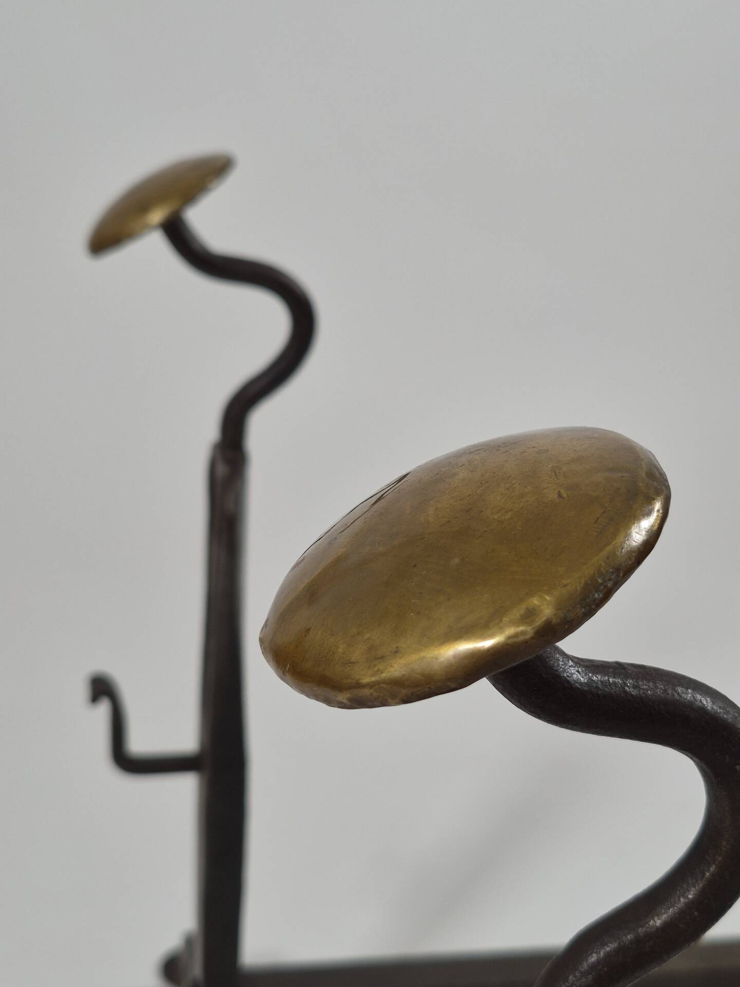 Pair of handforged metal and brass andirons