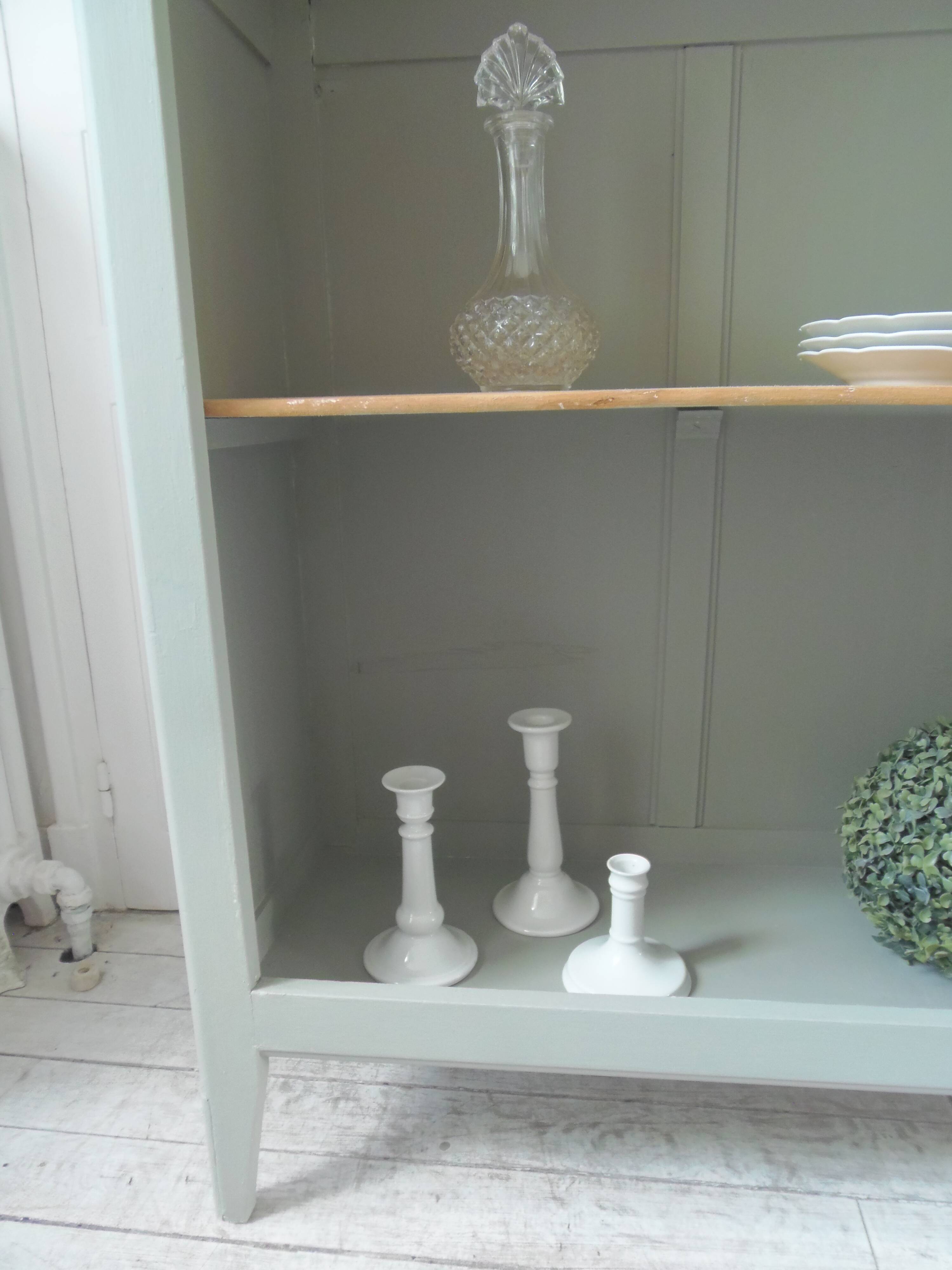 Vintage shallow bookcase re-enchanted in verdigris.