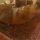 Extensible dining table from the Louis XVI period in mahogany with a banded top.
