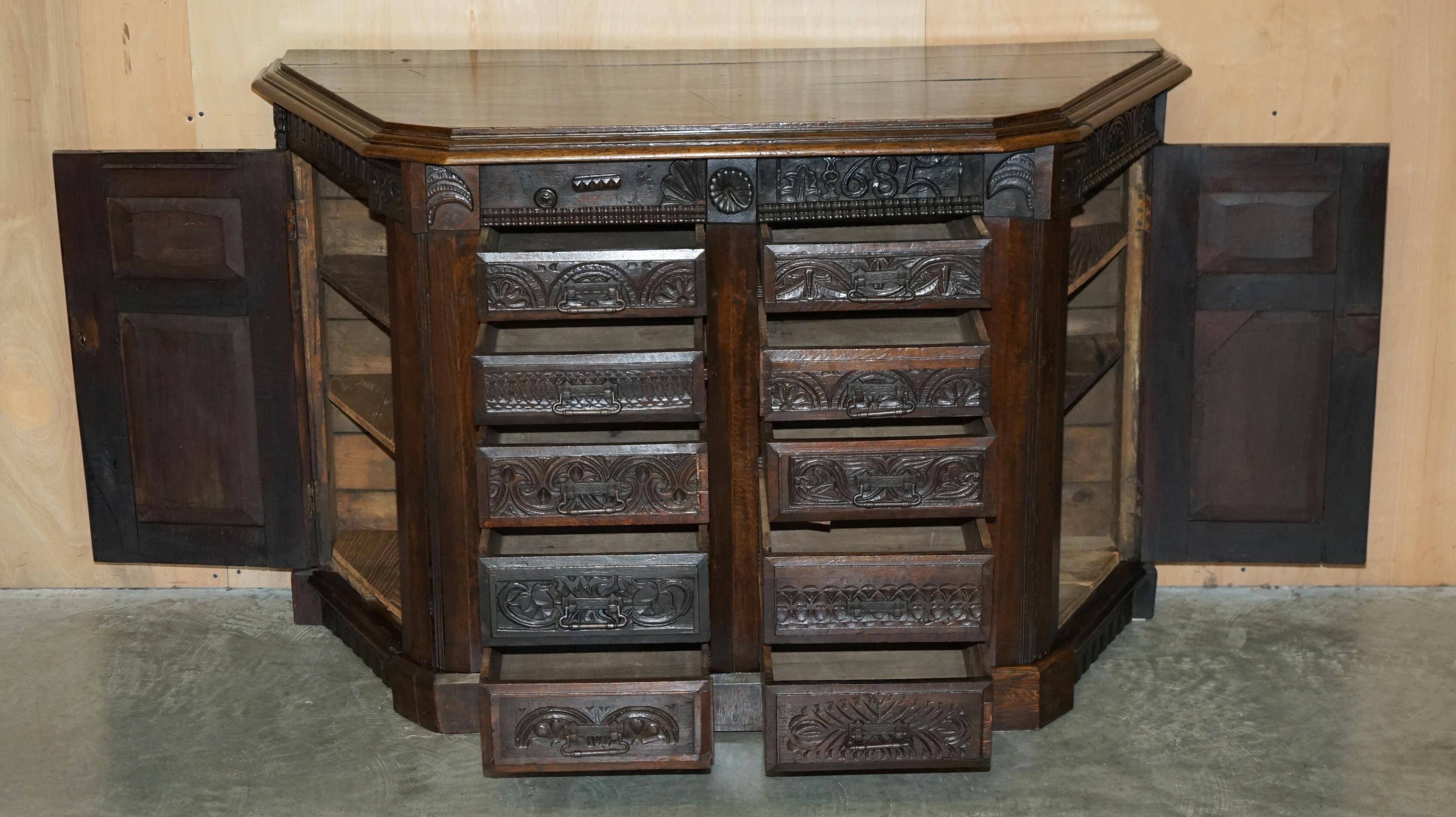 Hand-carved commode from 1685 with sideboards and side cupboards.