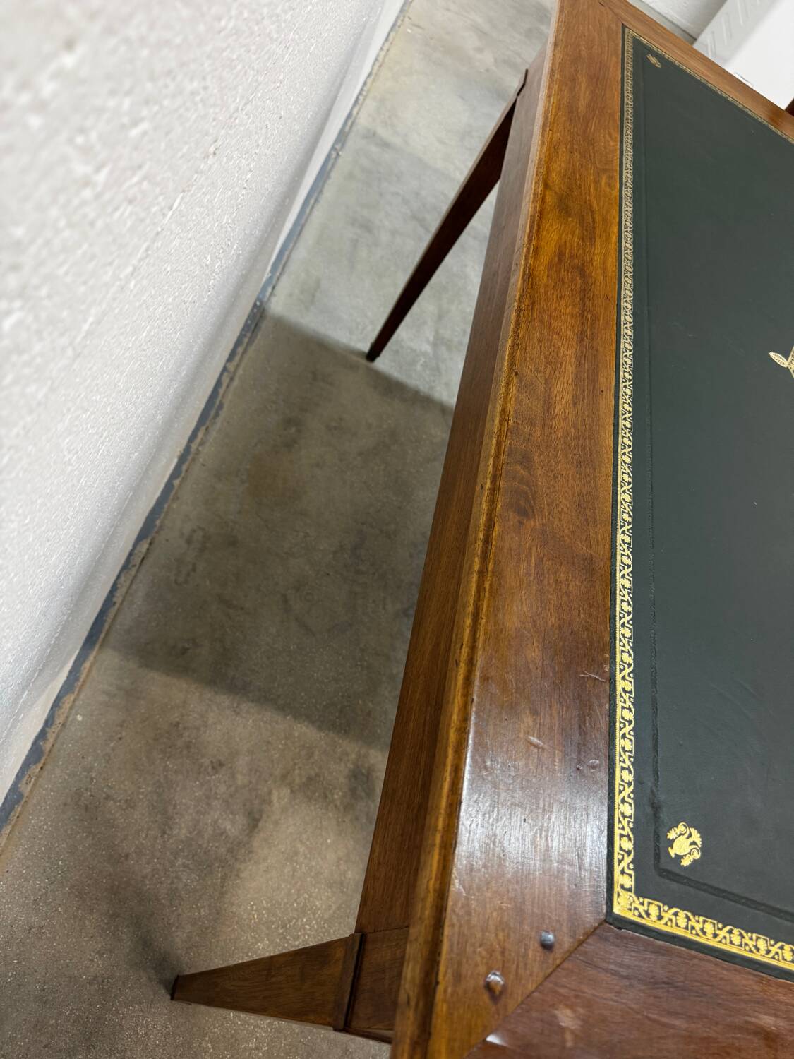 Louis XVI desk with green leather and shelves.