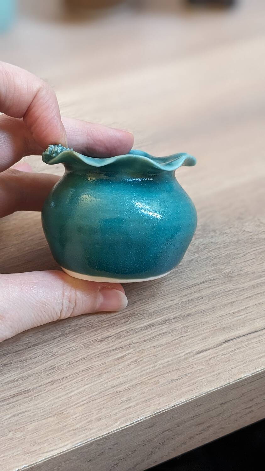 Small handmade turquoise pottery.
