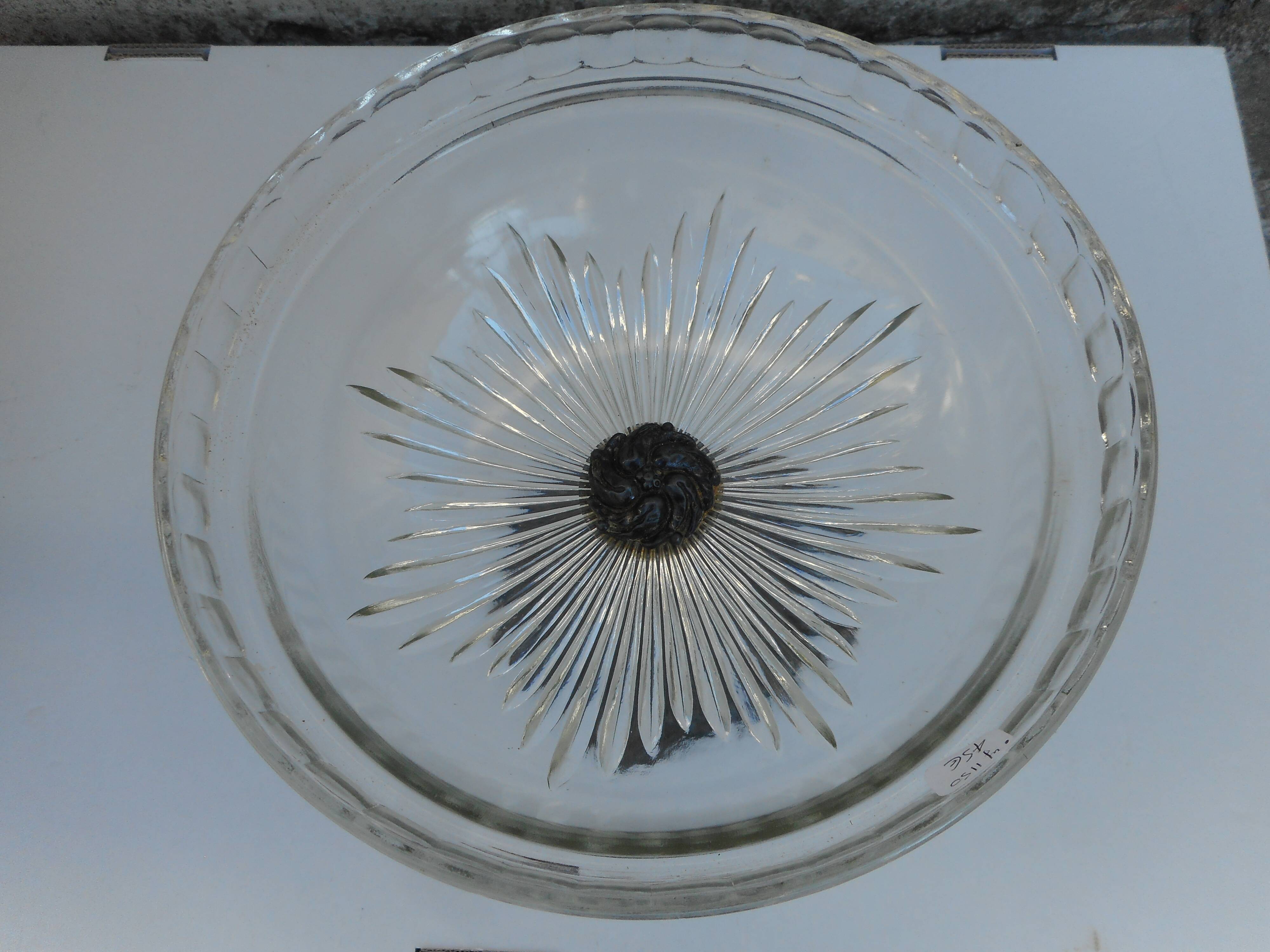 A glass cup on metal stand