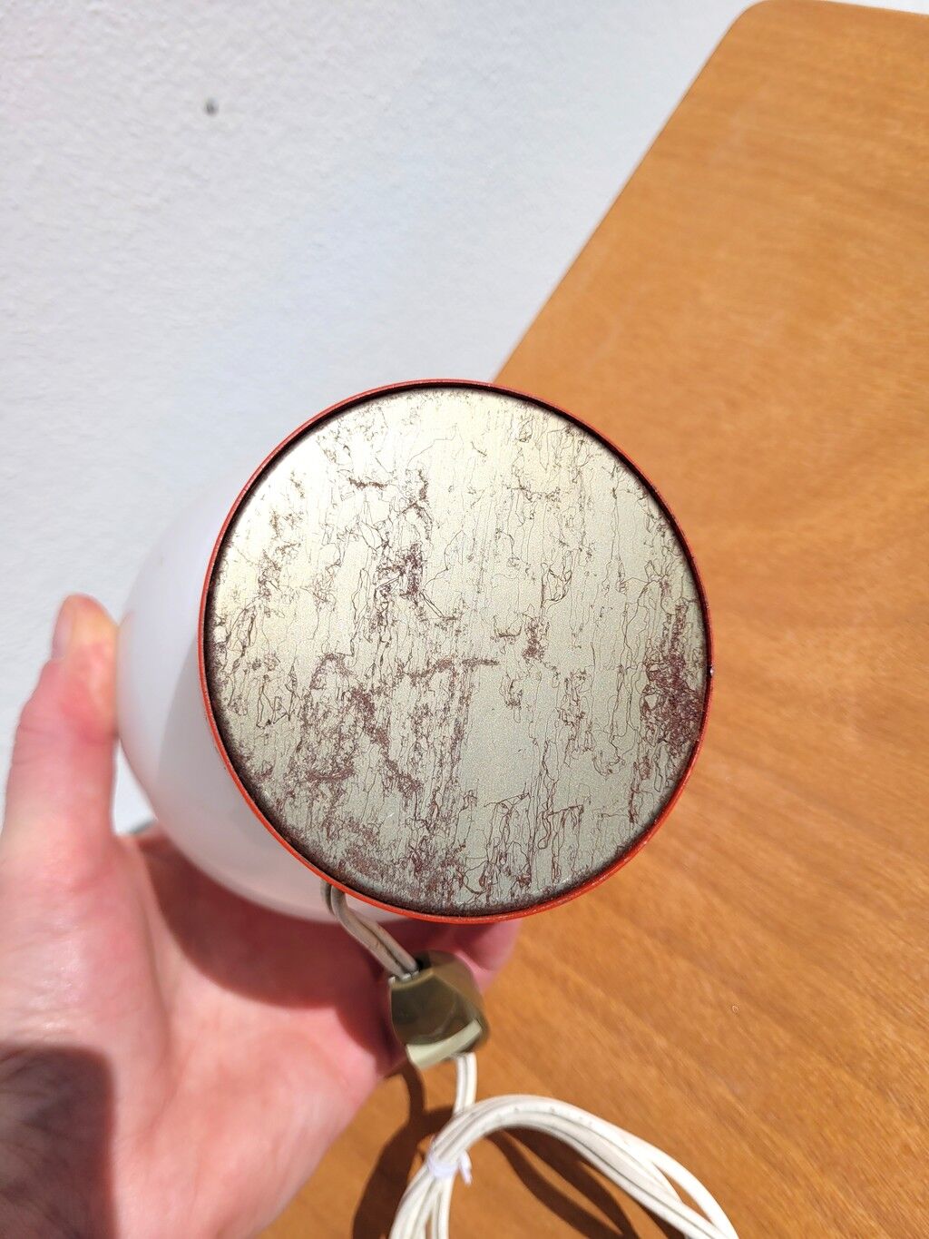 Small vintage opaline ball lamp with an orange base.