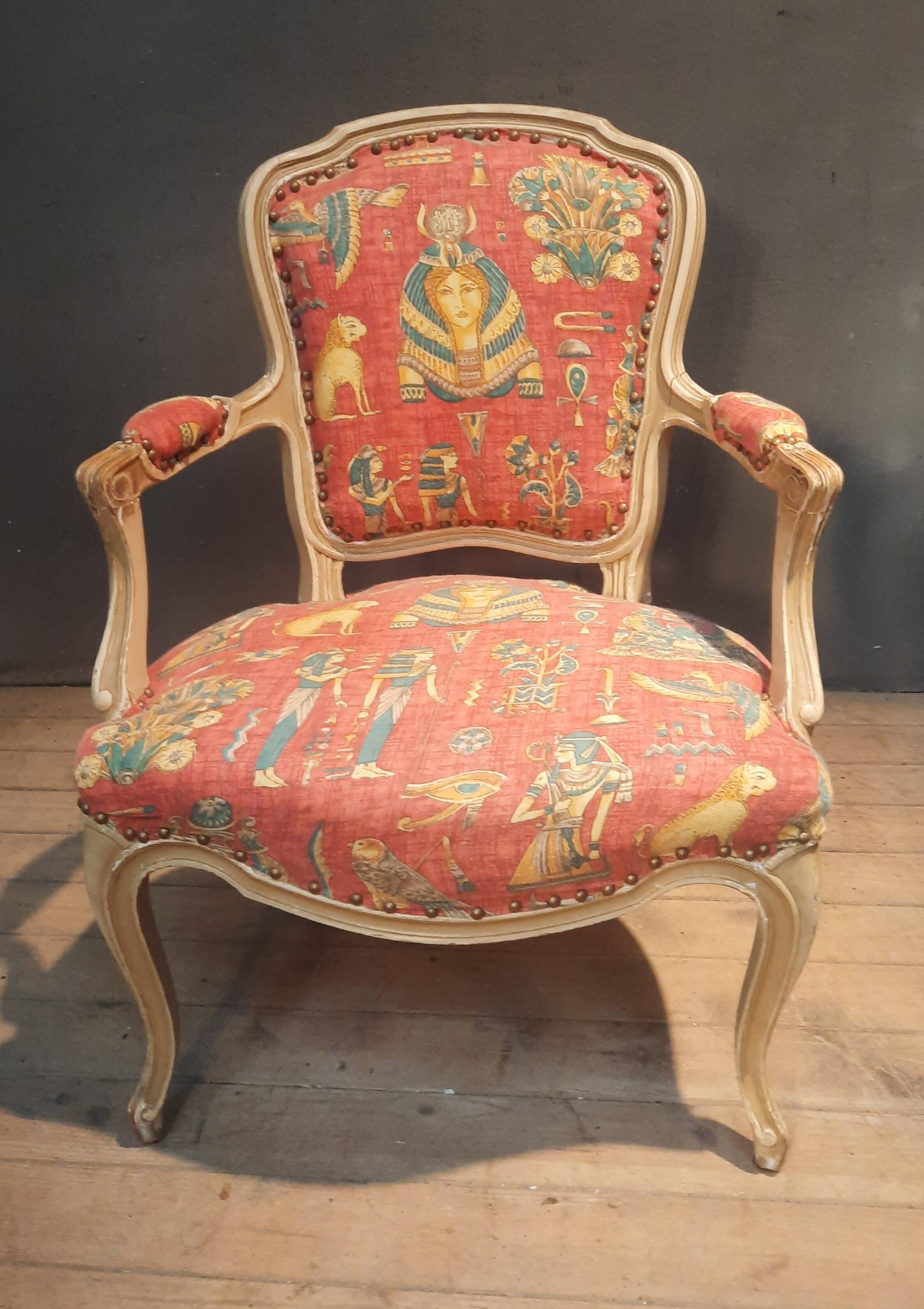 Louis XV style armchair upholstered with an Egyptian pattern.