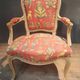 Louis XV style armchair upholstered with an Egyptian pattern.