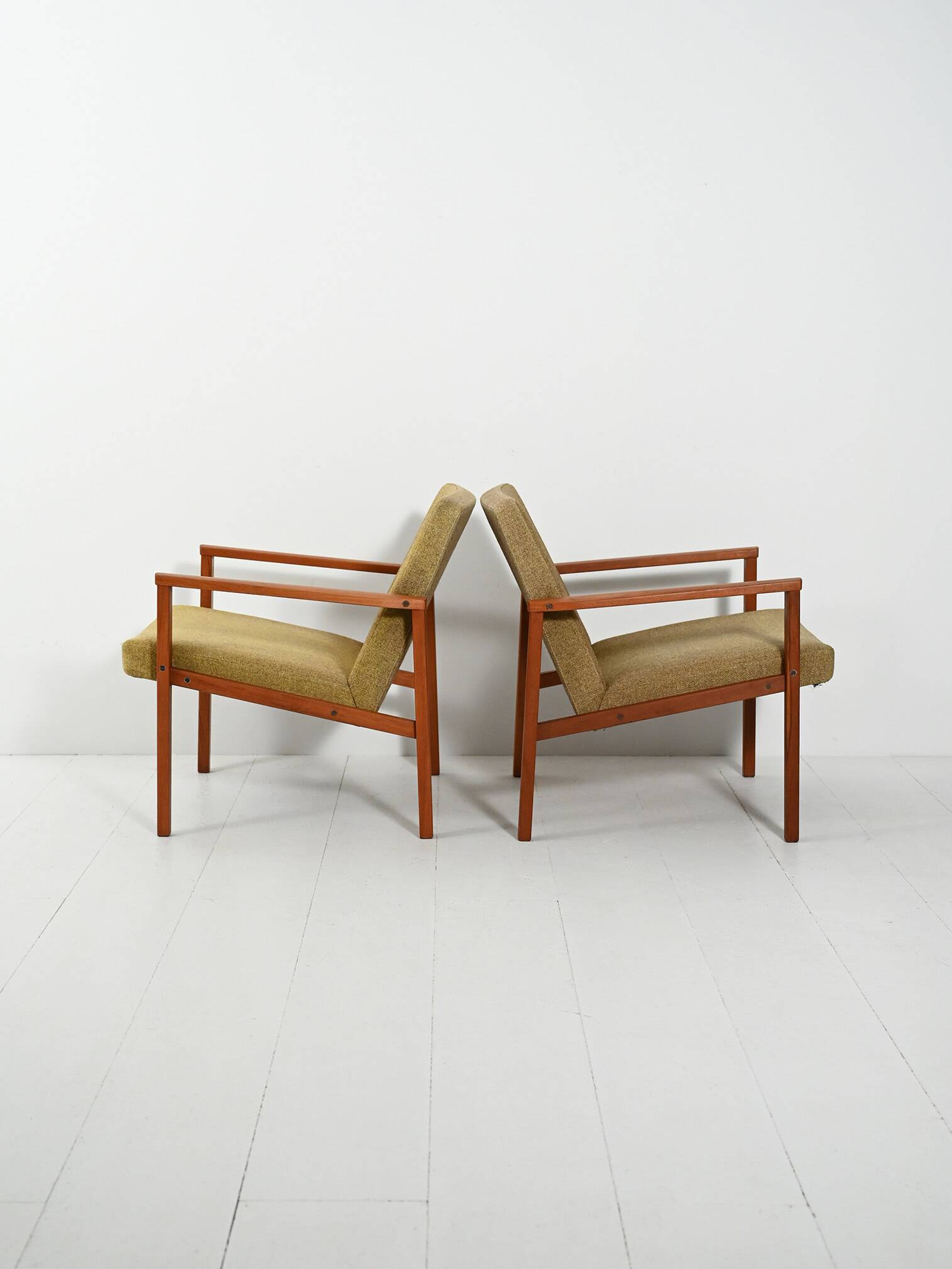 Pair of Danish teak armchairs with green upholstery