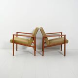 Pair of Danish teak armchairs with green upholstery