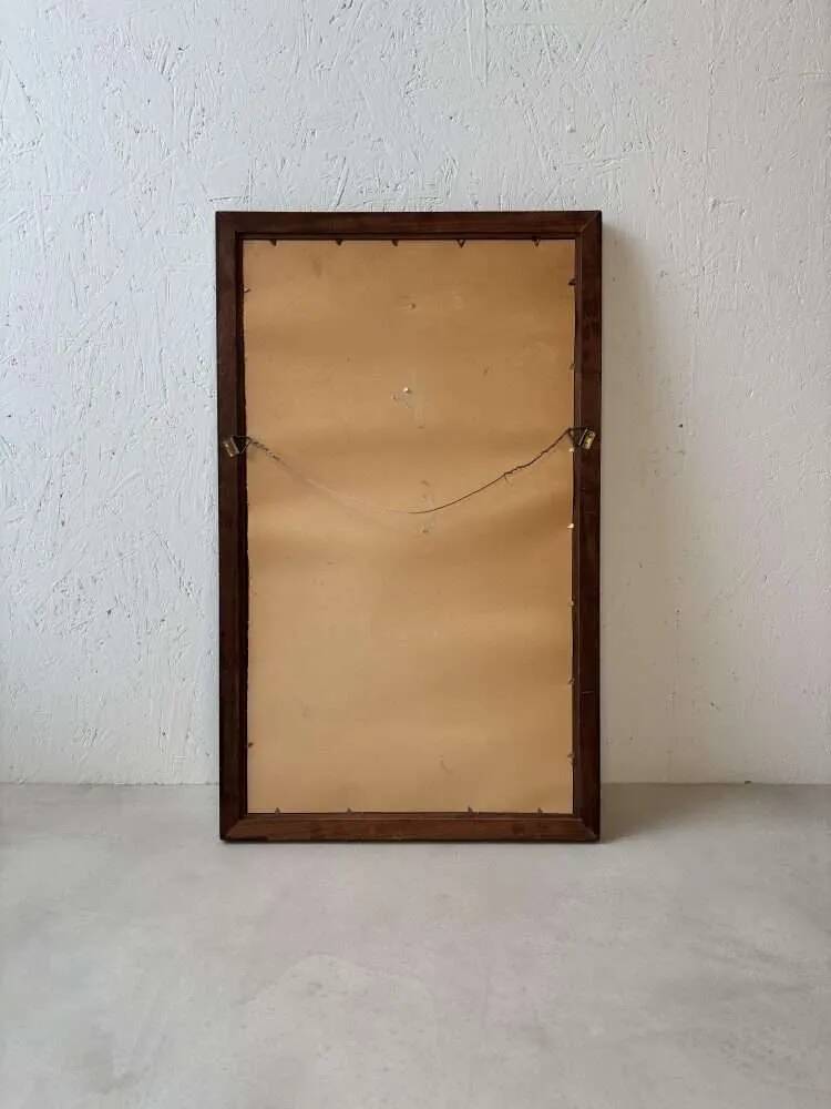 Danish wall mirror from the sixties with a sleek design.