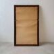 Danish wall mirror from the sixties with a sleek design.