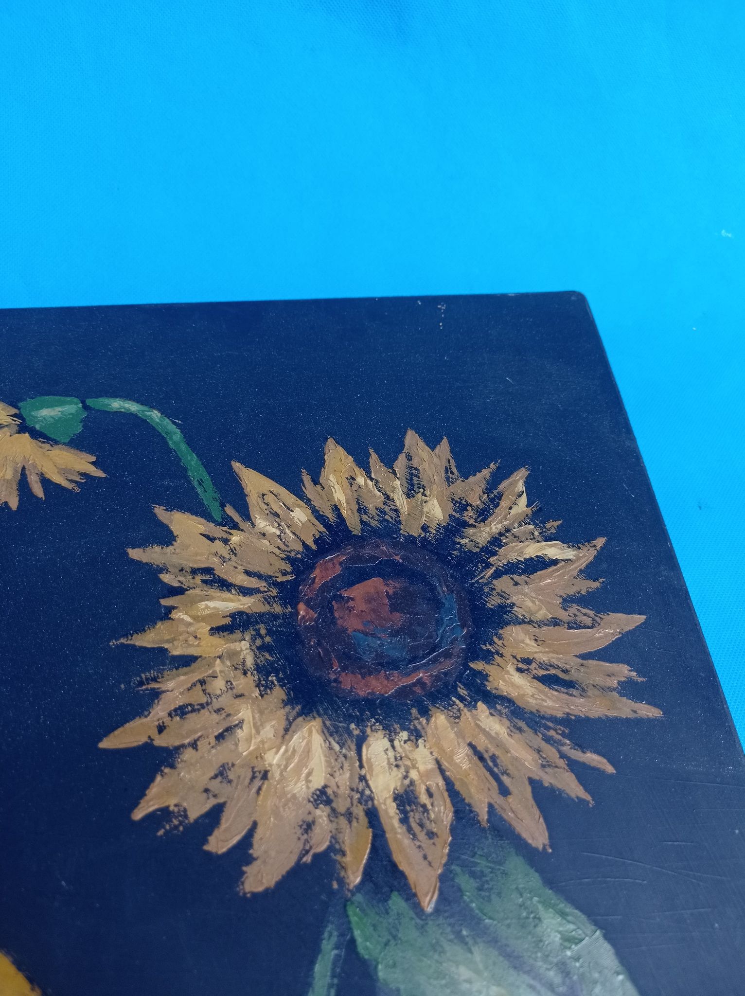 Painting of sunflowers in a vase comes from the 60's / 70's