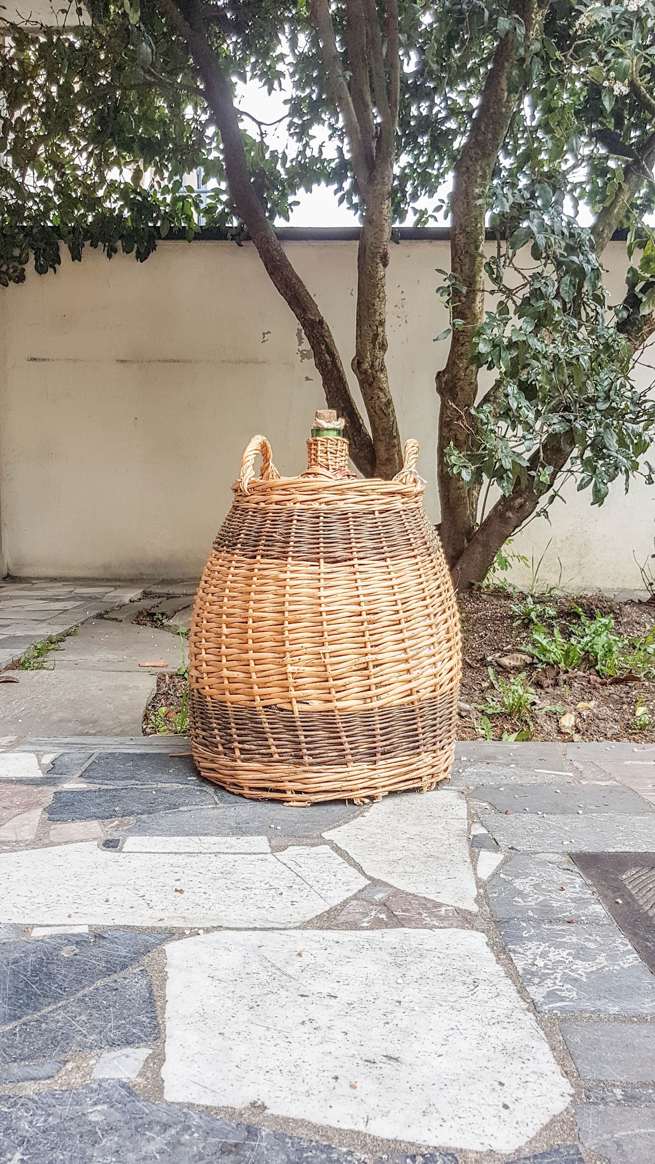 Demijohn covered with wicker
