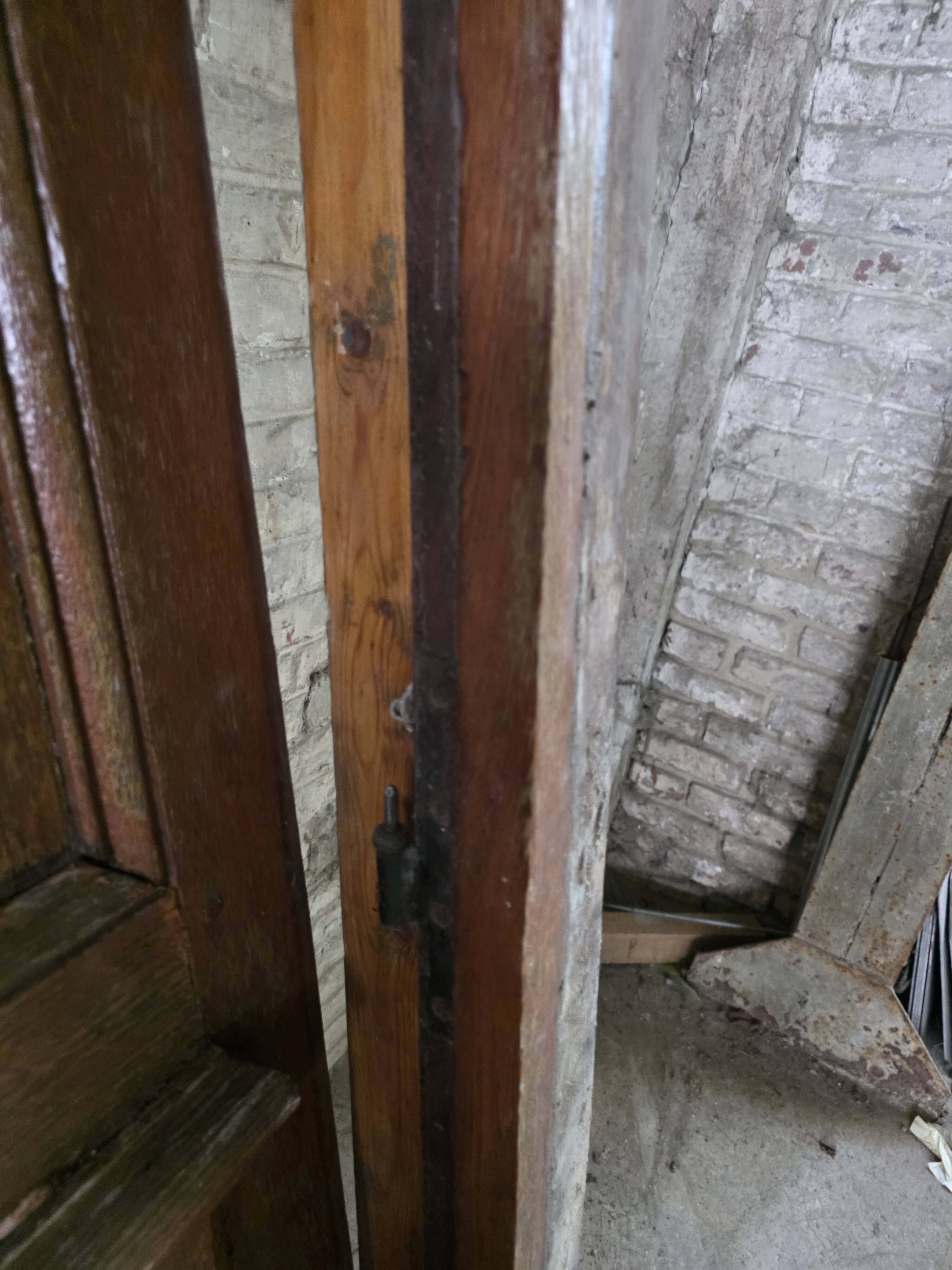 Old solid oak front door with frame and transom from the 19th century.