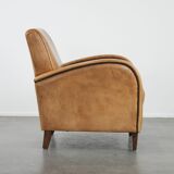 Luxury armchair made of cowhide leather with a beautiful warm colour scheme