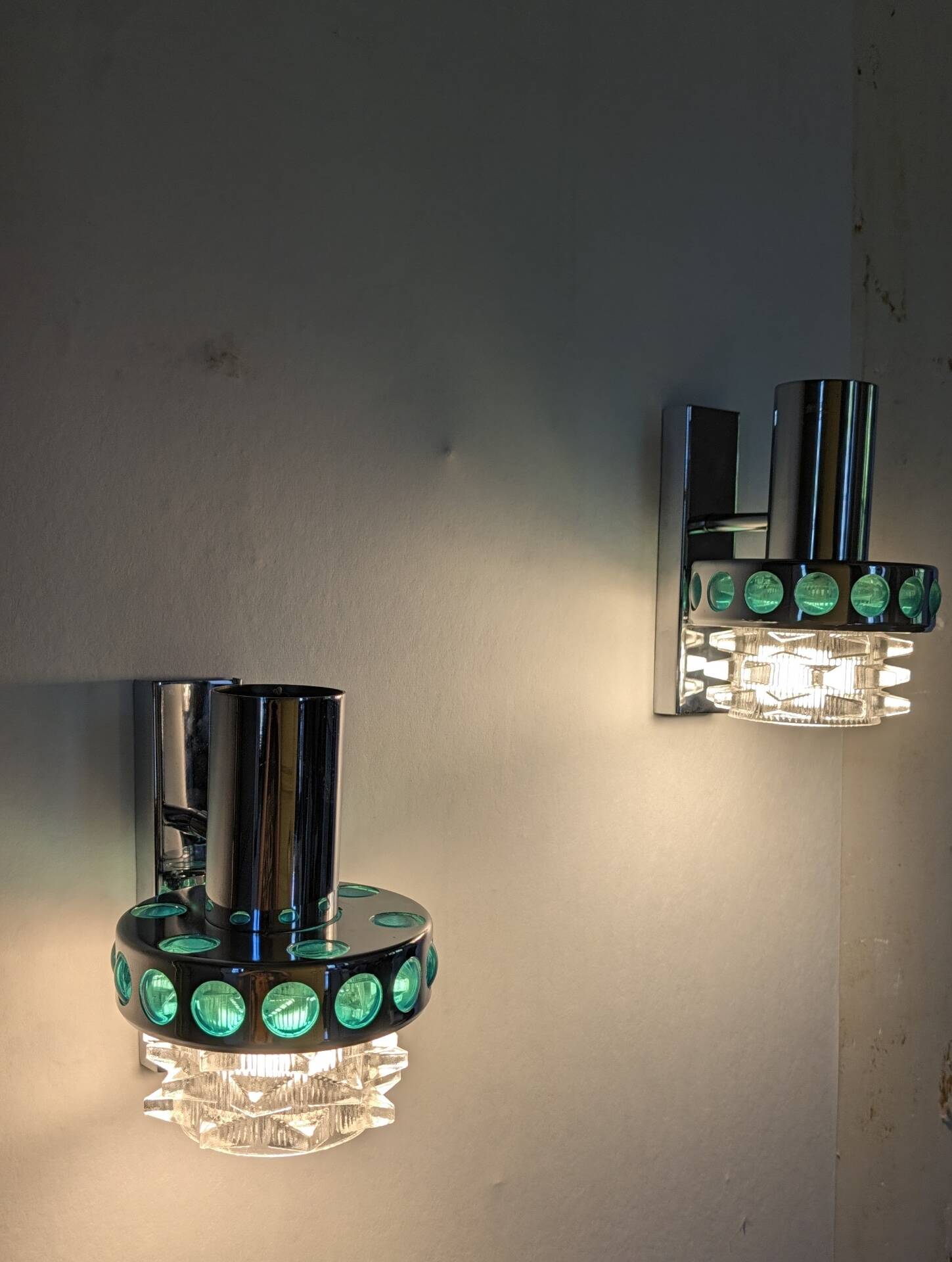 Pair of Space Age wall lights in chrome and green glass, 1970s.