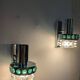 Pair of Space Age wall lights in chrome and green glass, 1970s.