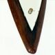 Italian sculptural wall mirror in wood from the 1960s.