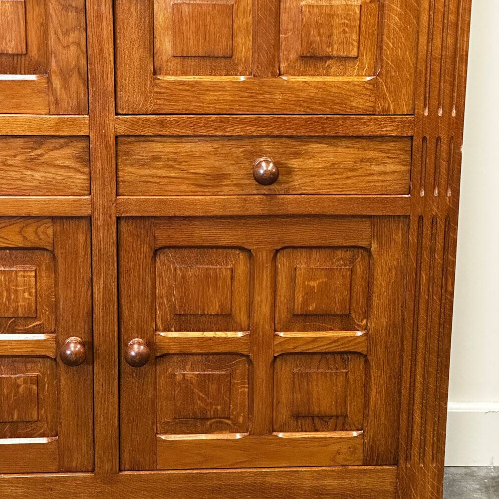 Artisan brutalist oak cabinet with turned knobs, France, 1970s