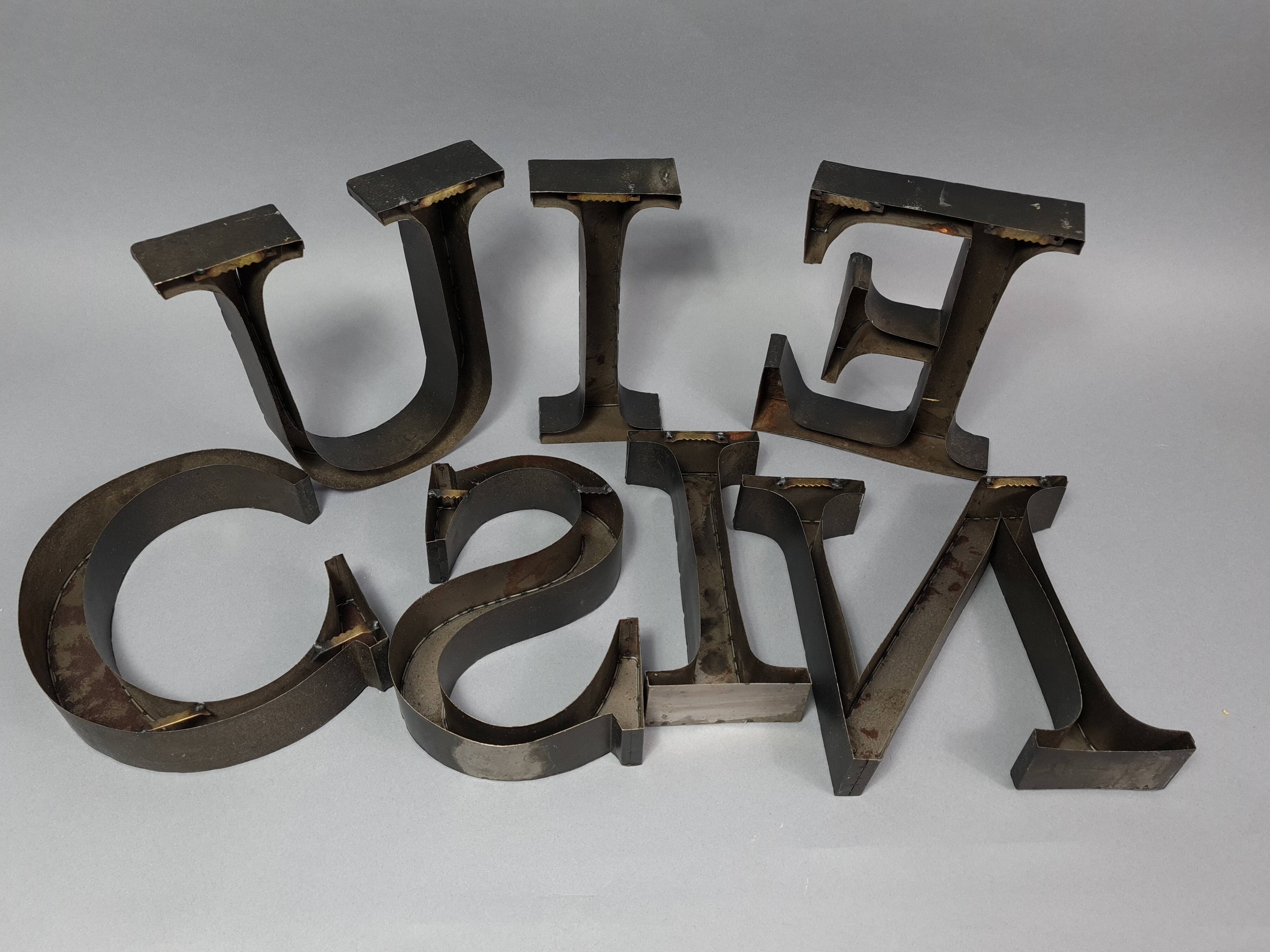 "kitchen" lettering set in blackened metal